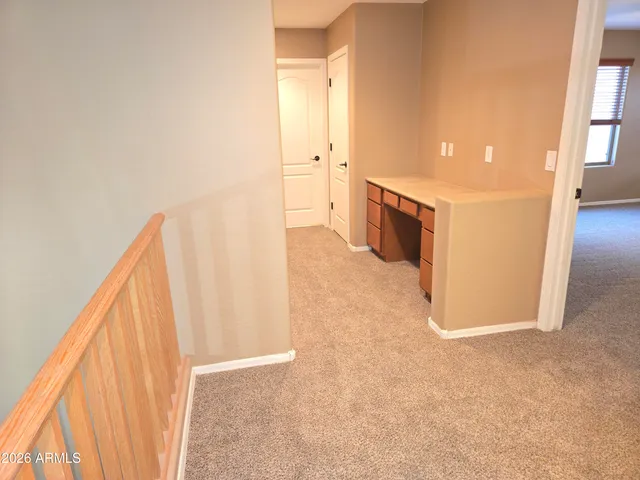 a bathroom with a granite countertop sink and mirror
