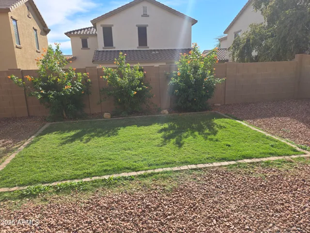 a view of a park with a slide and a child swing