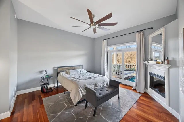 a bathroom with a tub a sink and a large mirror