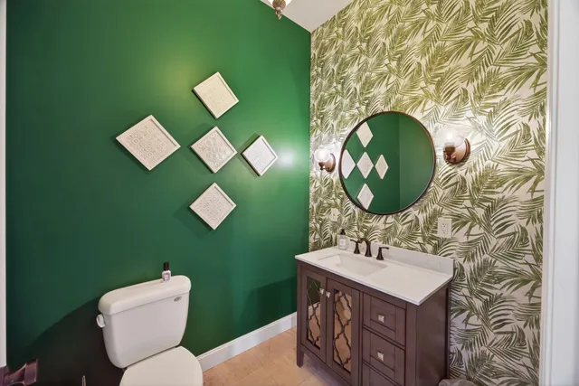 a spacious bathroom with a double vanity sink a mirror and a shower