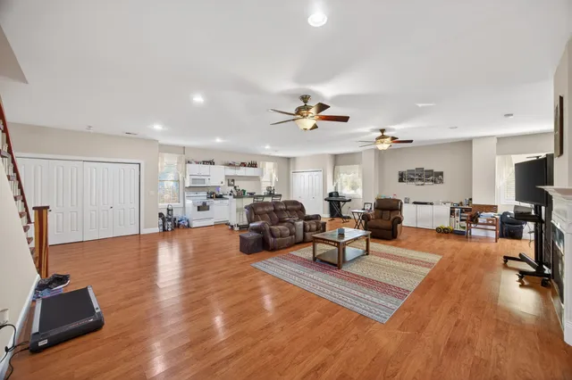 a view of a house with backyard porch and sitting area