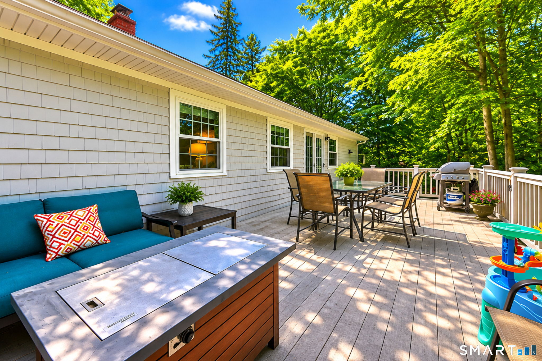 265 Shelter Rock Road Fairfield, CT 06825 - Photo 24 of 32 Expansive private deck! Plenty of space for dining and relaxing on a summer evening. Overlooks the wooded back area with sunset views.