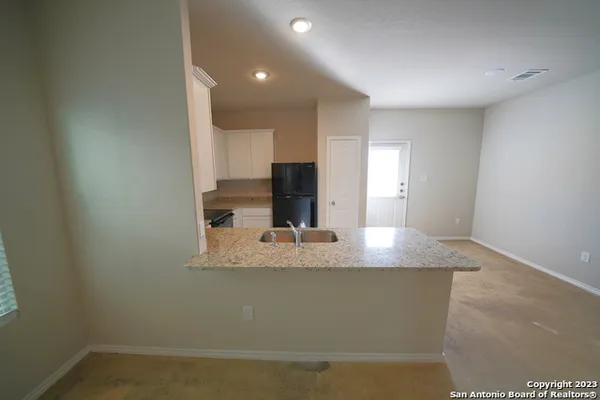 a view of a kitchen with a sink