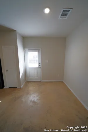 an empty room with windows