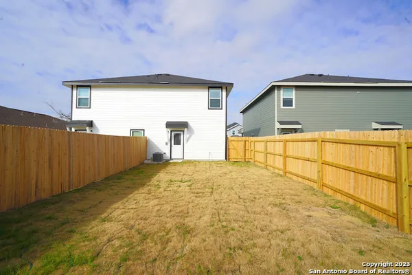 a view of backyard of a house