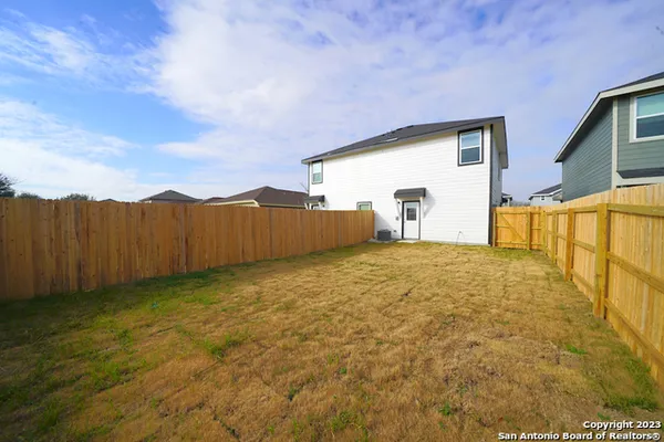 a view of back yard of the house