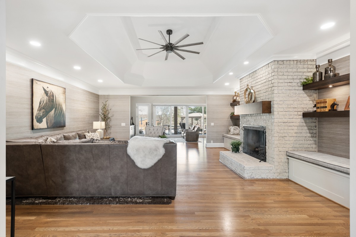 750 Upper Station Camp Creek Road Cottontown, TN 37048 - Photo 13 of 71 a living room with fireplace furniture and a wooden floor