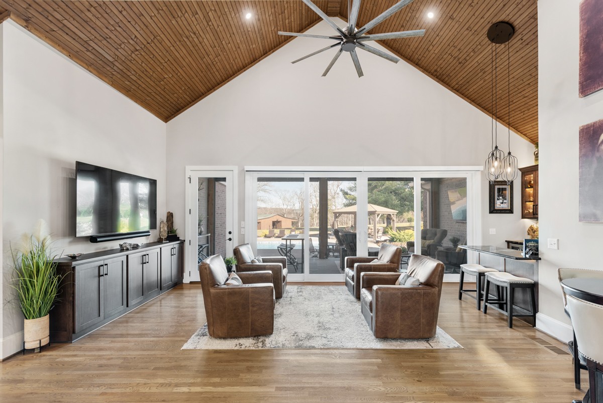 750 Upper Station Camp Creek Road Cottontown, TN 37048 - Photo 18 of 71 a living room with fireplace furniture and a flat screen tv