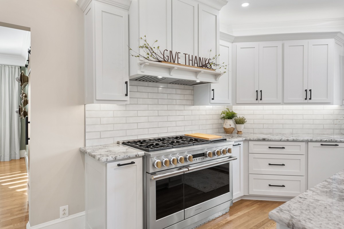 750 Upper Station Camp Creek Road Cottontown, TN 37048 - Photo 25 of 71 a kitchen with stainless steel appliances a stove and white cabinets