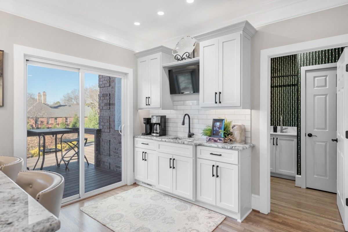 750 Upper Station Camp Creek Road Cottontown, TN 37048 - Photo 28 of 71 a kitchen with stainless steel appliances granite countertop a refrigerator and a stove top oven