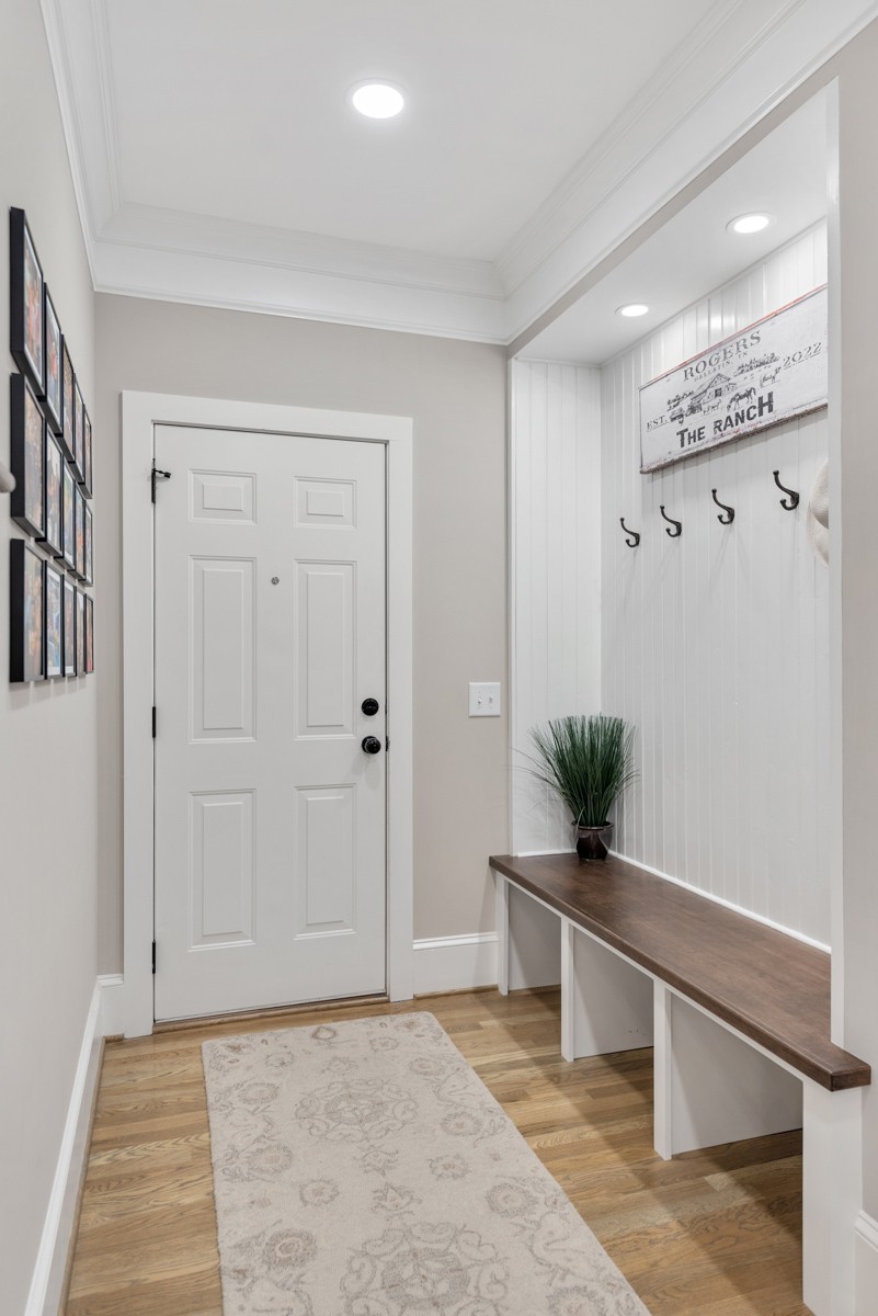 750 Upper Station Camp Creek Road Cottontown, TN 37048 - Photo 31 of 71 a living room with a potted plant and a rug
