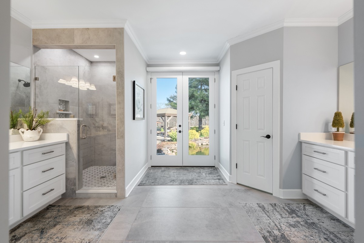 750 Upper Station Camp Creek Road Cottontown, TN 37048 - Photo 37 of 71 a bathroom with a glass door shower a sink and a mirror
