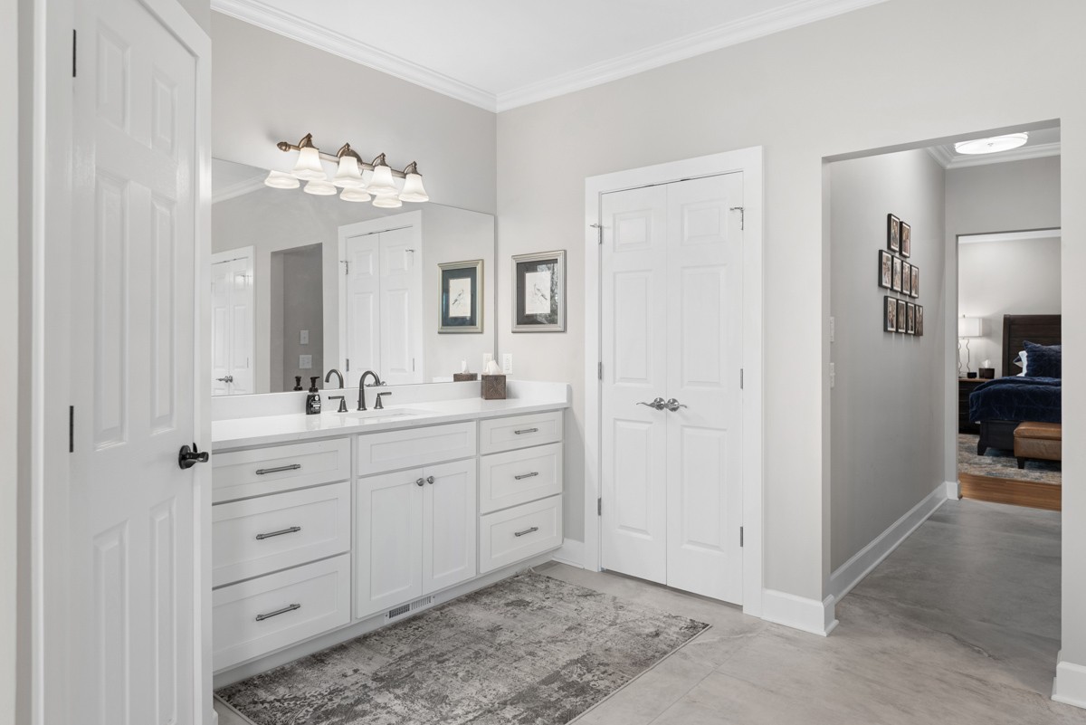 750 Upper Station Camp Creek Road Cottontown, TN 37048 - Photo 38 of 71 a spacious bathroom with a double vanity sink shower and a mirror