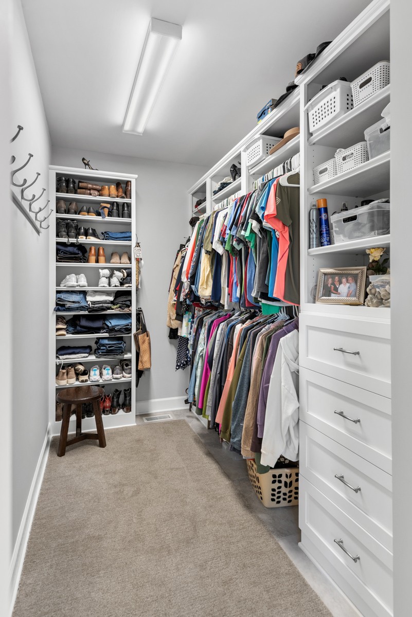 750 Upper Station Camp Creek Road Cottontown, TN 37048 - Photo 41 of 71 a view of walk in closet with clothes and shoes