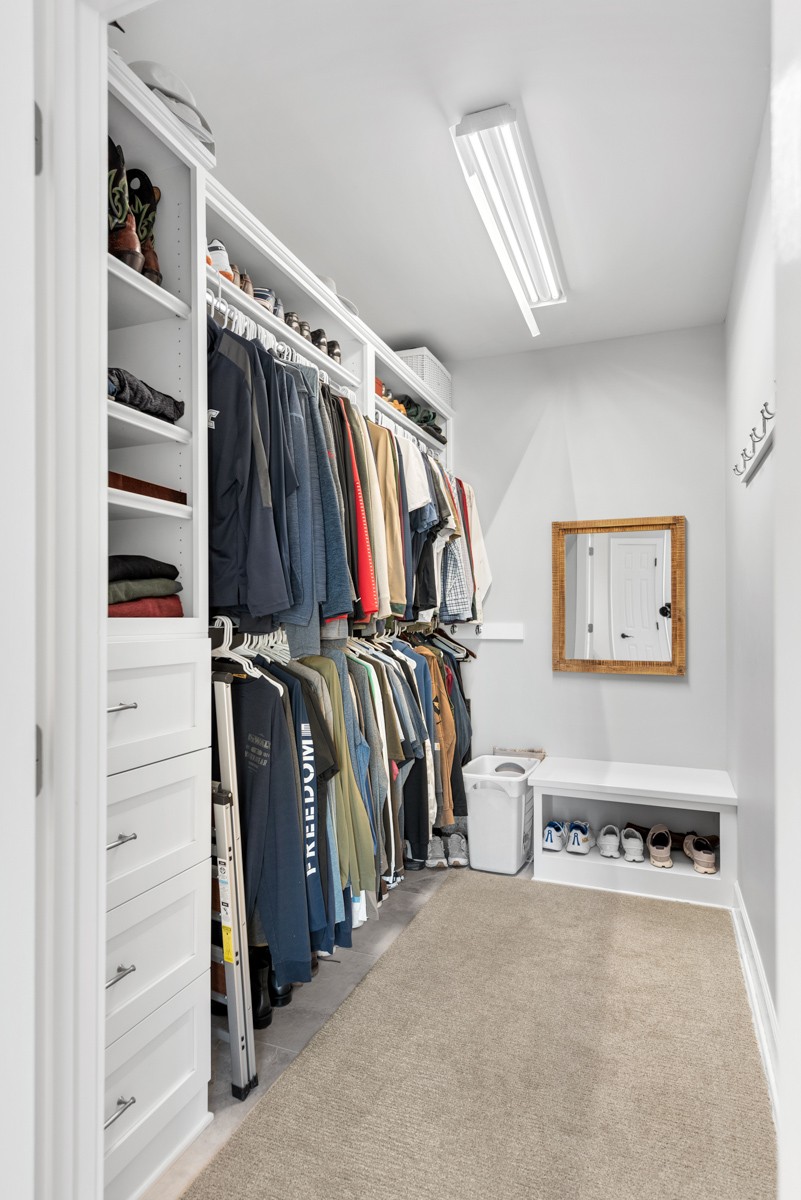 750 Upper Station Camp Creek Road Cottontown, TN 37048 - Photo 42 of 71 a view of walk in closet with clothes and shoes