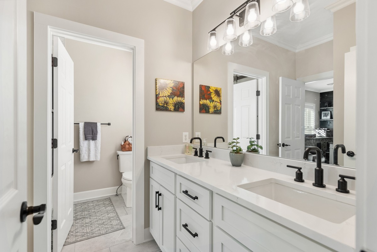 750 Upper Station Camp Creek Road Cottontown, TN 37048 - Photo 44 of 71 a bathroom with a sink and a mirror