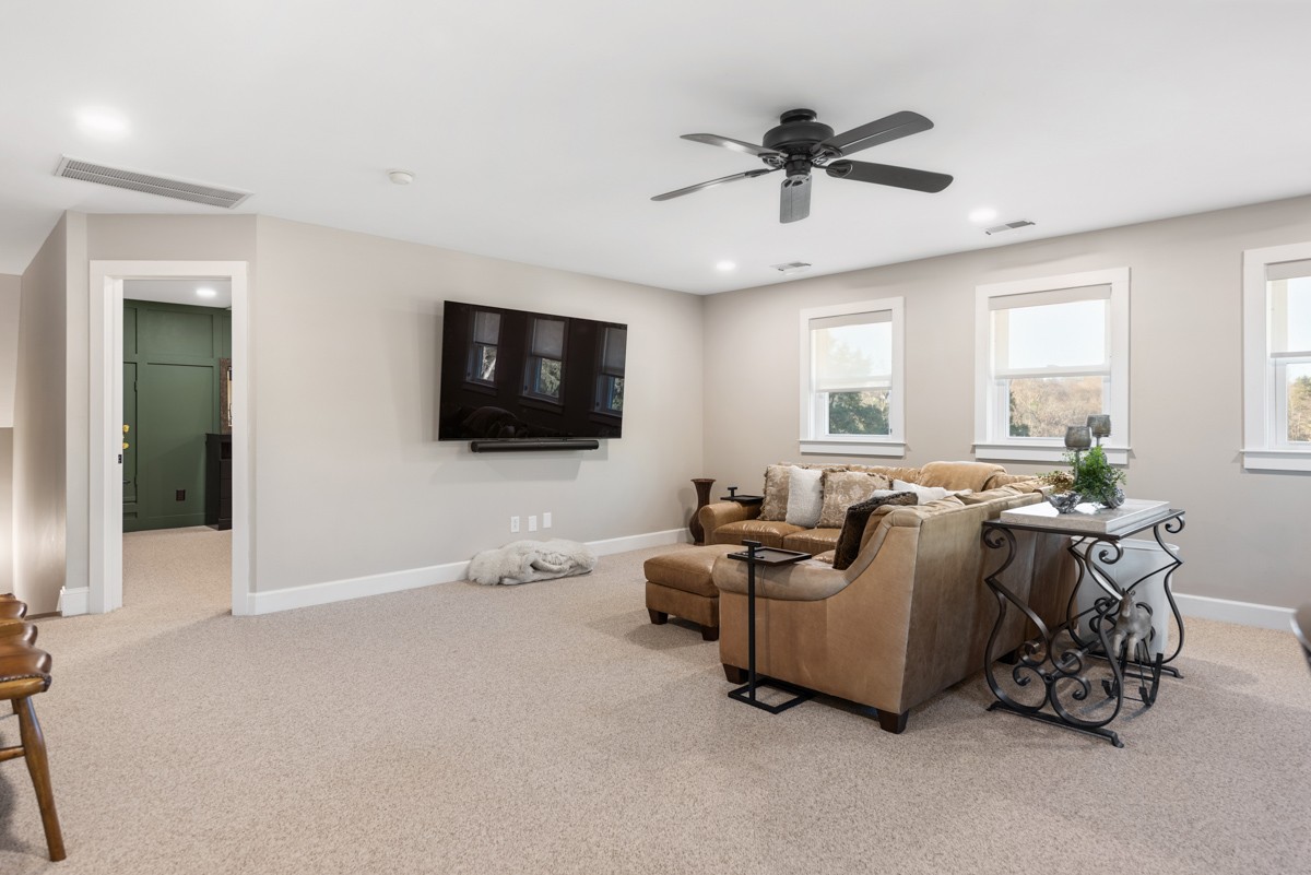 750 Upper Station Camp Creek Road Cottontown, TN 37048 - Photo 47 of 71 a living room with furniture and a flat screen tv
