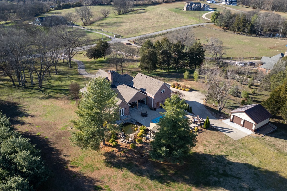750 Upper Station Camp Creek Road Cottontown, TN 37048 - Photo 51 of 71 an aerial view of house with yard swimming pool and outdoor seating