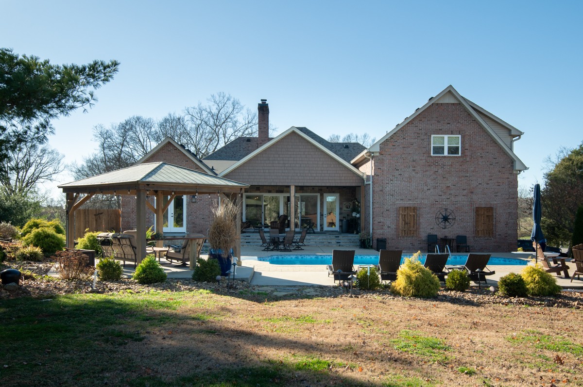 750 Upper Station Camp Creek Road Cottontown, TN 37048 - Photo 53 of 71 a front view of a house with a yard and car parked