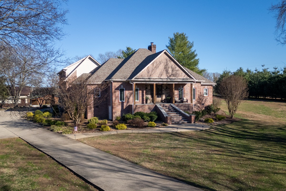 750 Upper Station Camp Creek Road Cottontown, TN 37048 - Photo 6 of 71 a front view of a house with swimming pool