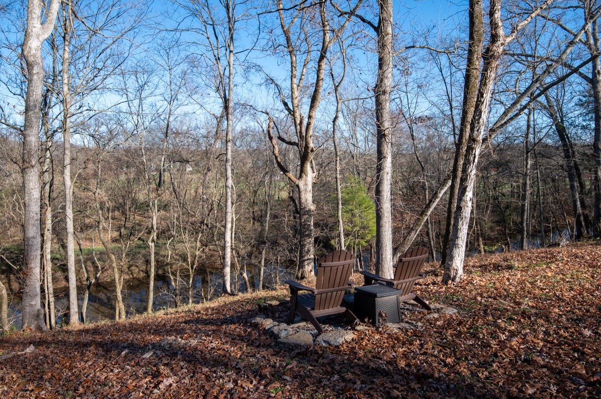 750 Upper Station Camp Creek Road Cottontown, TN 37048 - Photo 67 of 71 a view of a patio with table and chairs and potted plants