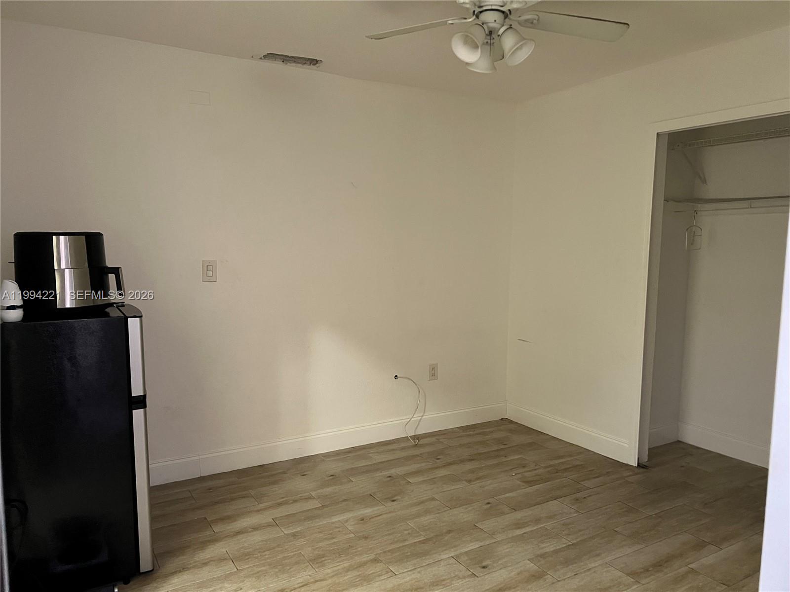 14880 Southwest 56th Terrace, Unit 3 Miami, FL 33193 - Photo 6 of 8 wooden floor in an empty room