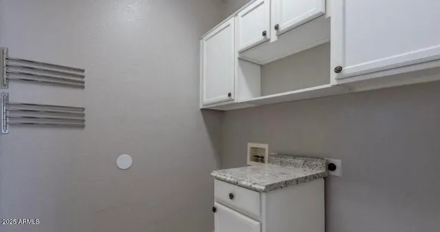 a bathroom with a sink and cabinets