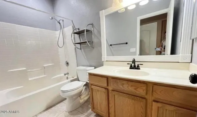 a bathroom with a sink toilet tub and shower