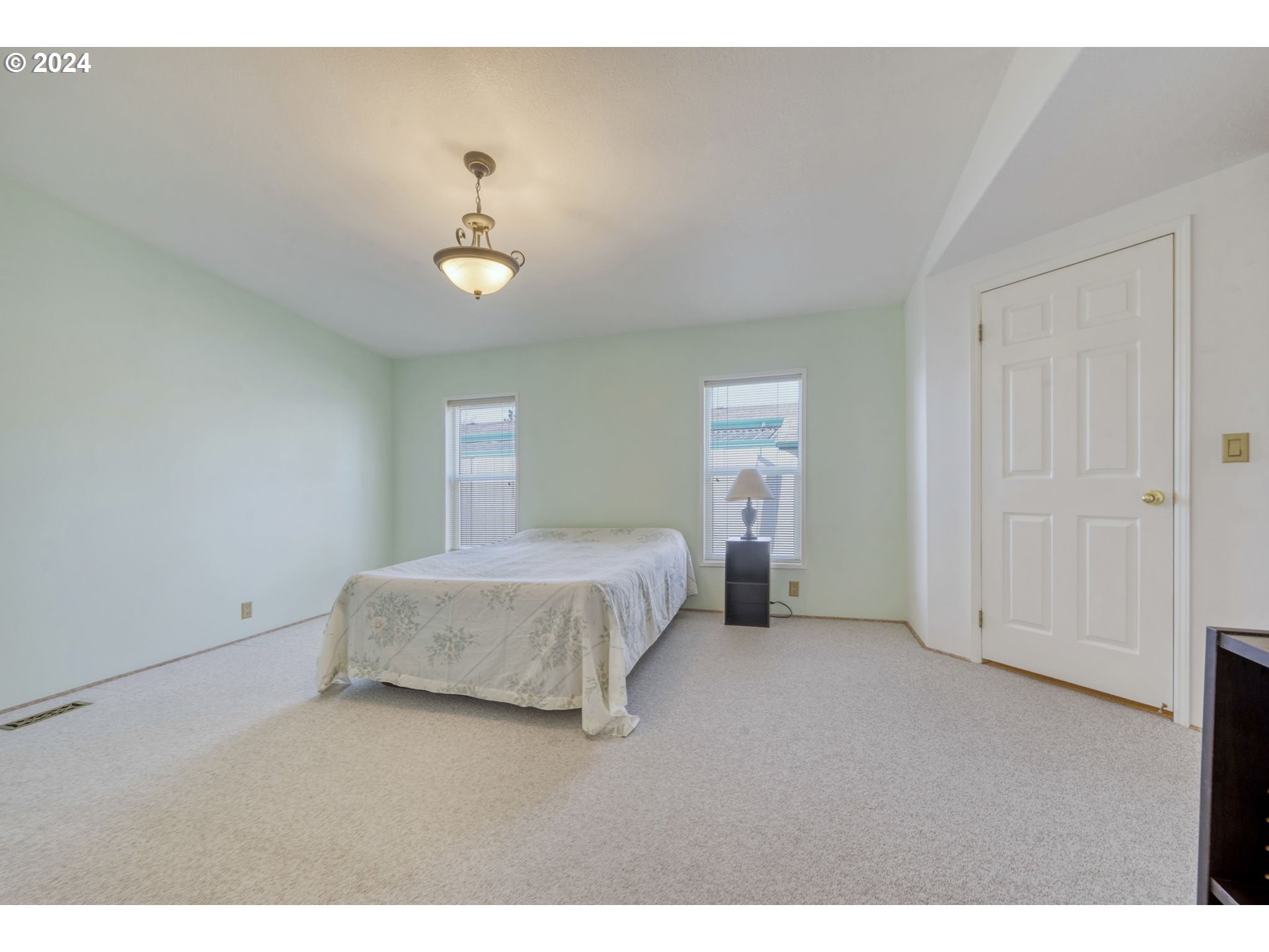2150 Laura Street, Unit 217 Springfield, OR 97477 - Photo 17 of 32 a bedroom with a bed and closet
