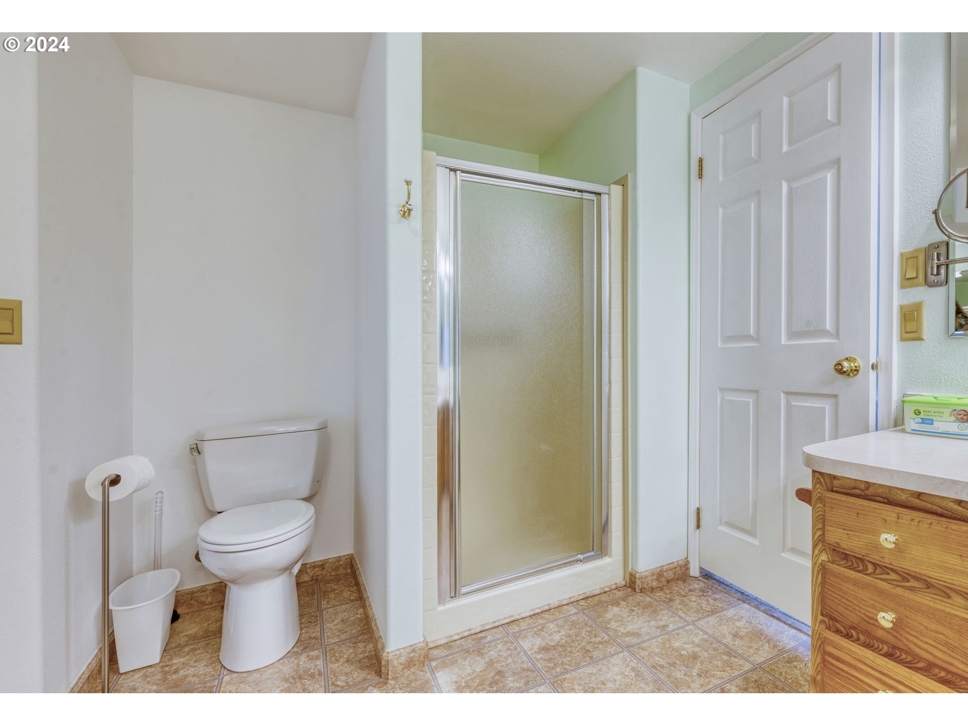 2150 Laura Street, Unit 217 Springfield, OR 97477 - Photo 21 of 32 a bathroom with a toilet and a shower