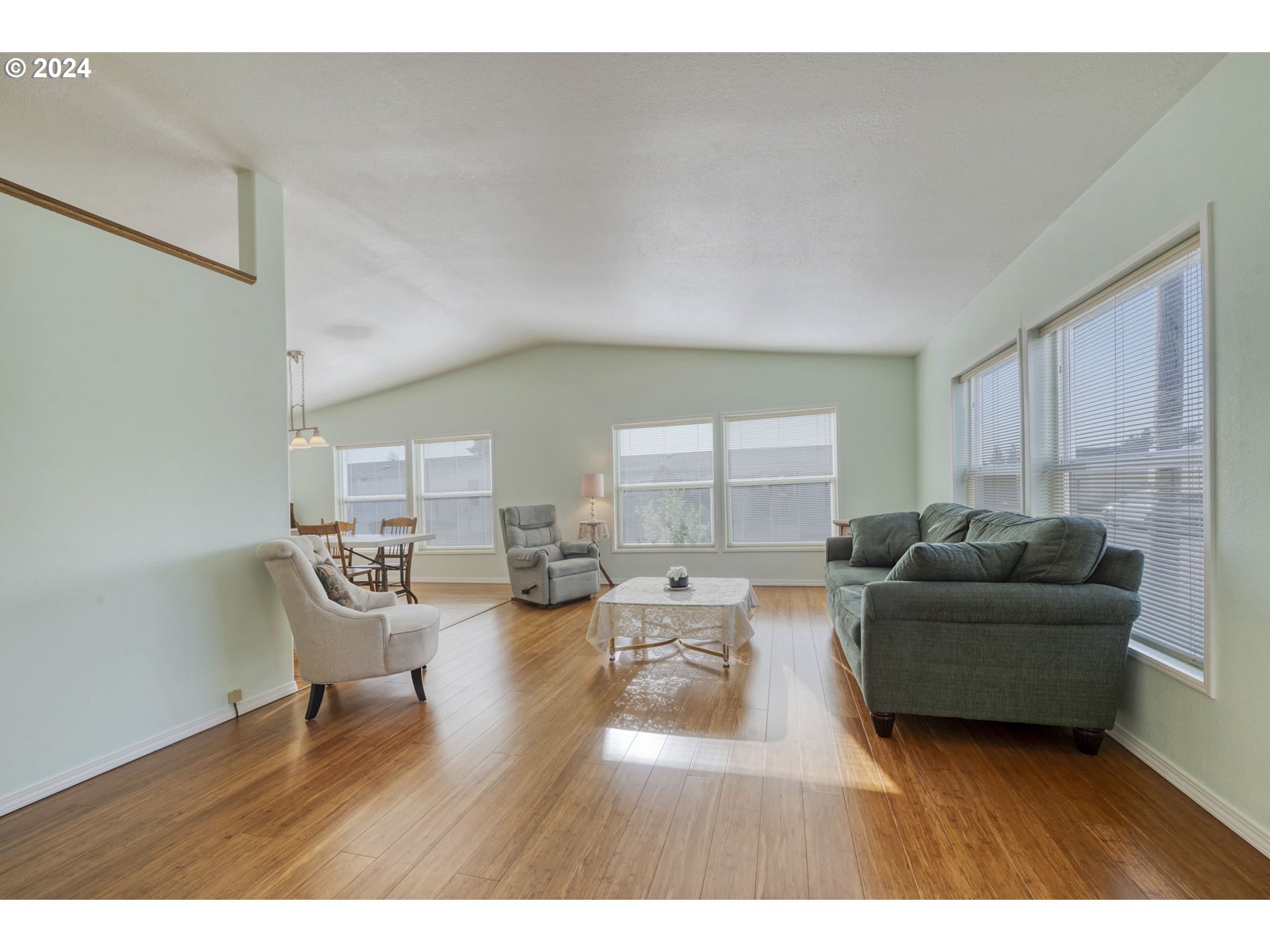 2150 Laura Street, Unit 217 Springfield, OR 97477 - Photo 5 of 32 a living room with furniture and a wooden floor