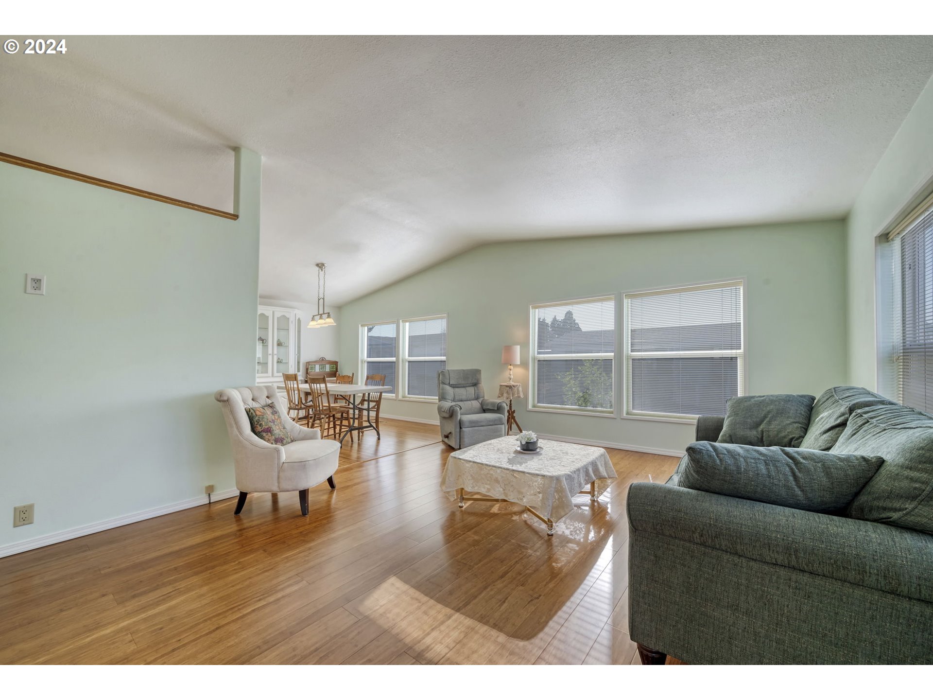2150 Laura Street, Unit 217 Springfield, OR 97477 - Photo 7 of 32 a living room with furniture and a large window