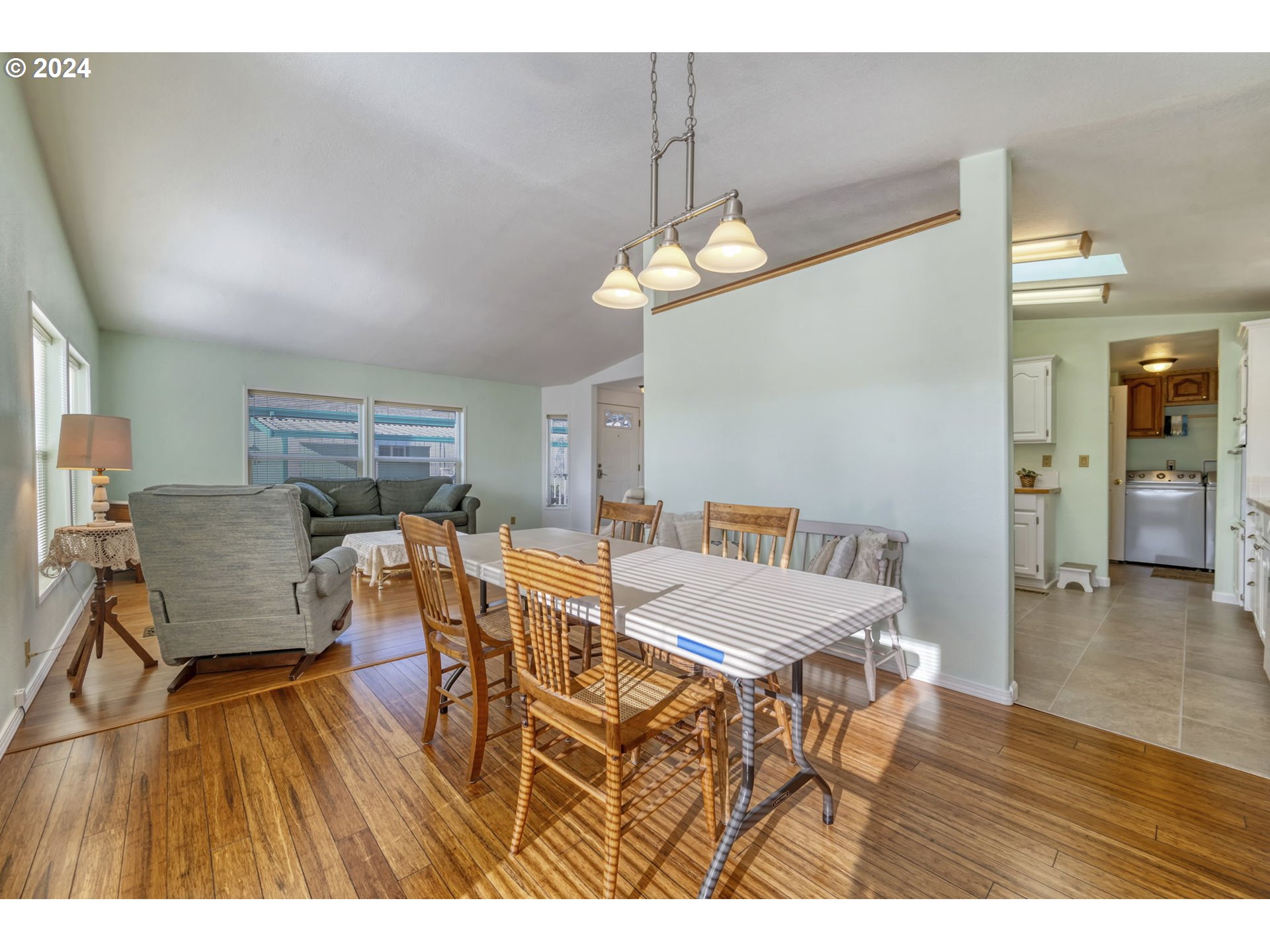 2150 Laura Street, Unit 217 Springfield, OR 97477 - Photo 10 of 32 a view of a dining room with furniture and wooden floor
