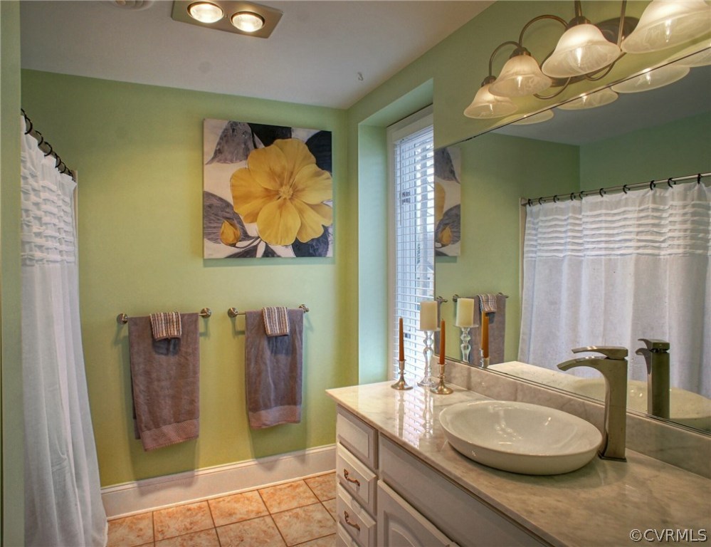 3070 Vistapoint Road Midlothian, VA 23113 - Photo 14 of 25 a bathroom with a granite countertop sink and a mirror