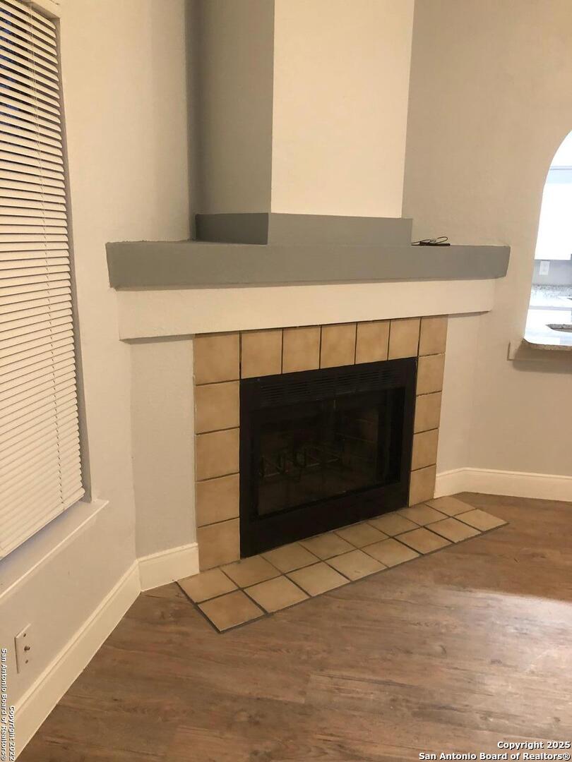 8401 Forest Ridge Drive San Antonio, TX 78239 - Photo 12 of 12 a living room with a fireplace