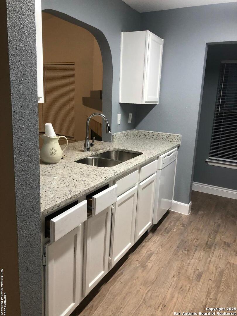 8401 Forest Ridge Drive San Antonio, TX 78239 - Photo 7 of 12 a kitchen with granite countertop a sink and a stove