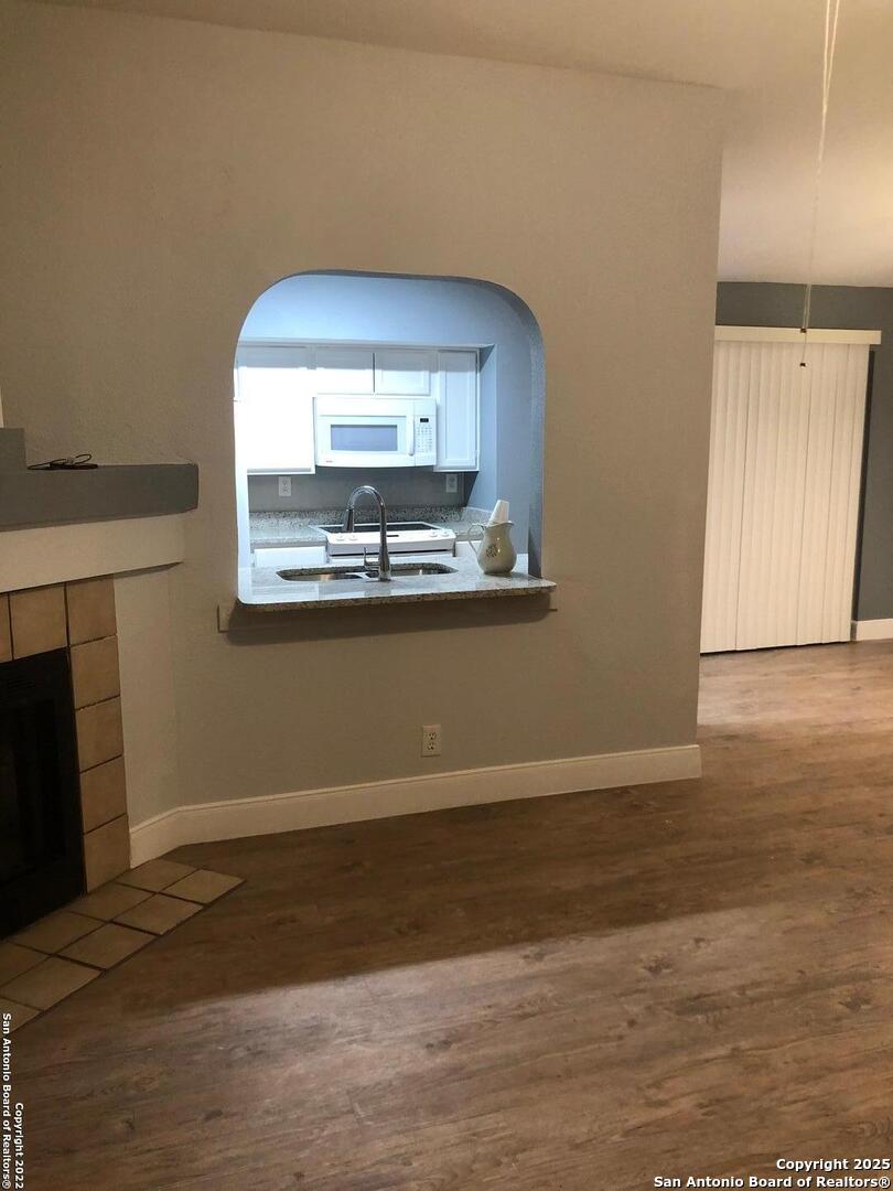 8401 Forest Ridge Drive San Antonio, TX 78239 - Photo 10 of 12 a view of a room with wooden floor and fireplace