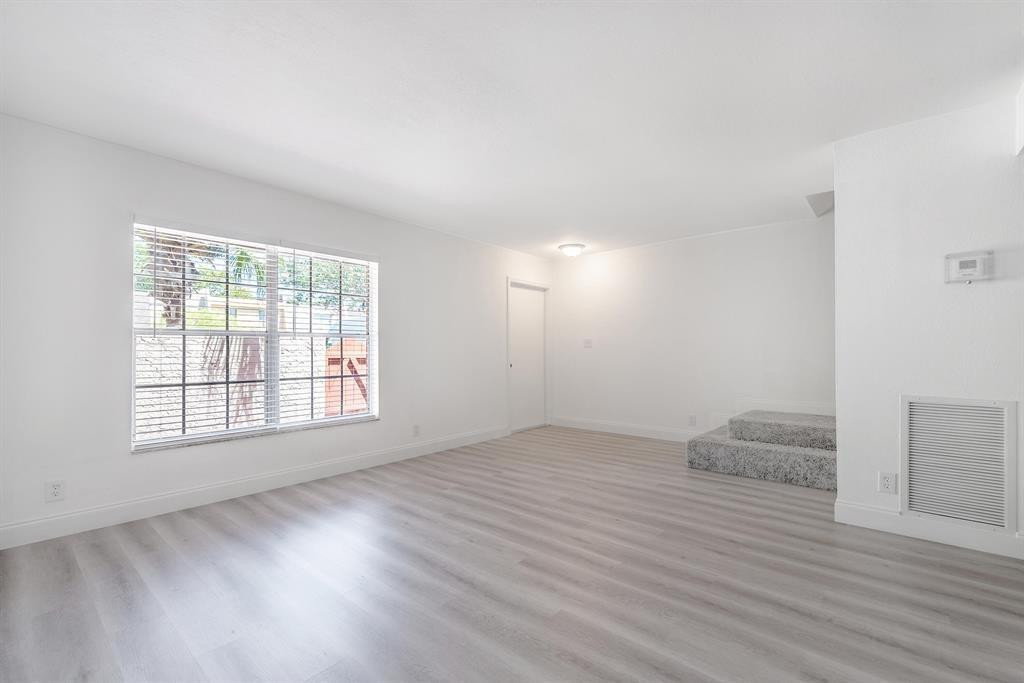 7500 Northwest 75th Street Fort Lauderdale, FL 33321 - Photo 15 of 16 an empty room with wooden floor and windows