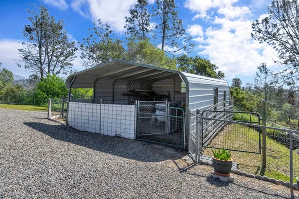a kitchen with stainless steel appliances kitchen island granite countertop a sink and cabinets