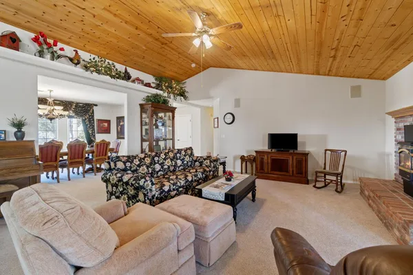 a spacious bathroom with a sink double vanity granite and a mirror