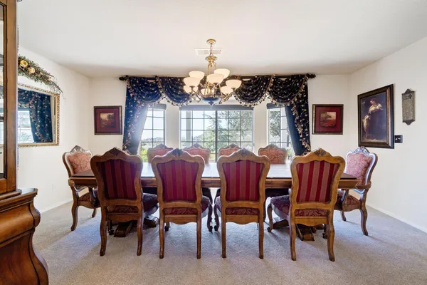 a view of a backyard with swimming pool