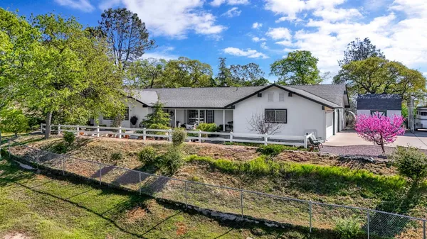 a view of a house with a garden