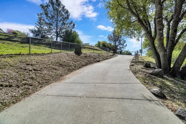 a view of a workspace with furniture and a potted plant