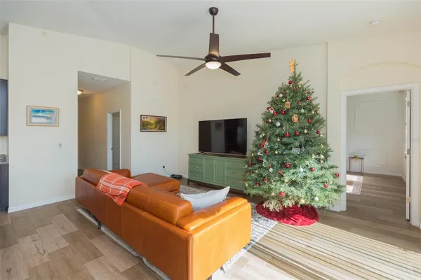 a bedroom with a bed and a potted plant