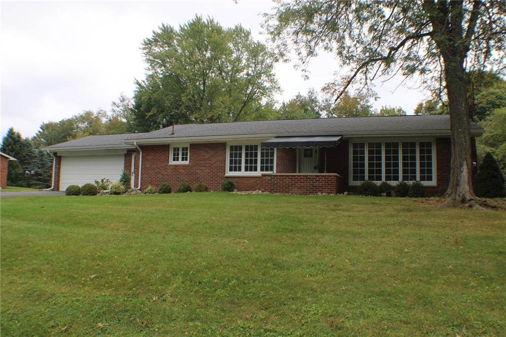 312 Cherokee Drive Butler, PA 16001 - Photo 1 of 40 a front view of a house with a garden