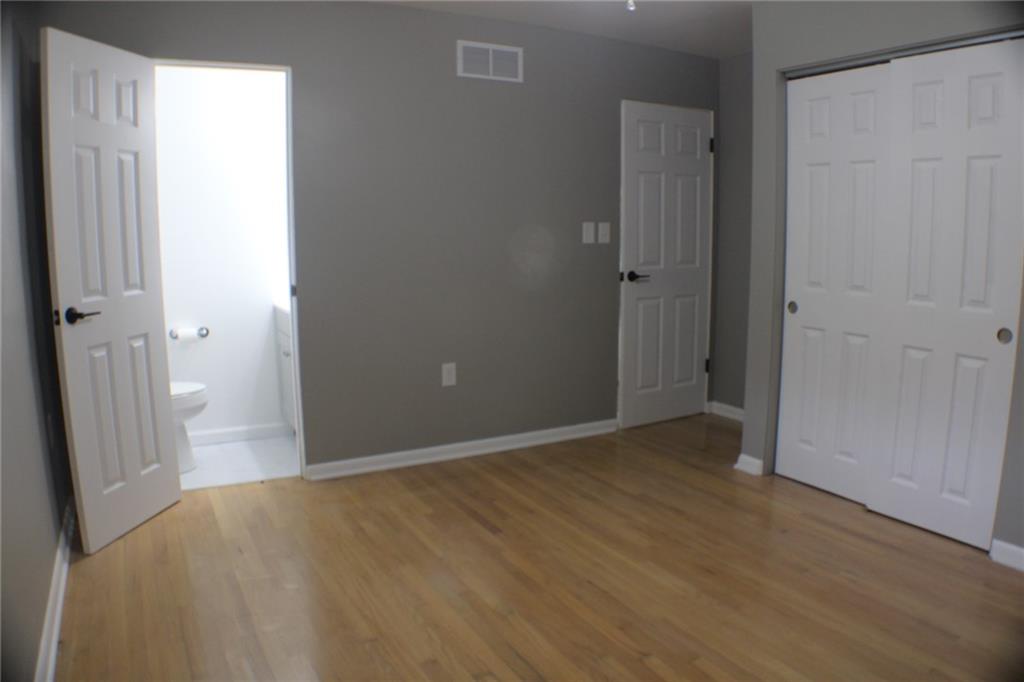 312 Cherokee Drive Butler, PA 16001 - Photo 11 of 40 an empty room with wooden floor and windows