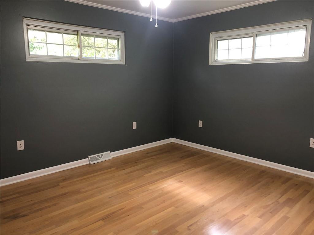 312 Cherokee Drive Butler, PA 16001 - Photo 12 of 40 a view of empty room with wooden floor and fan