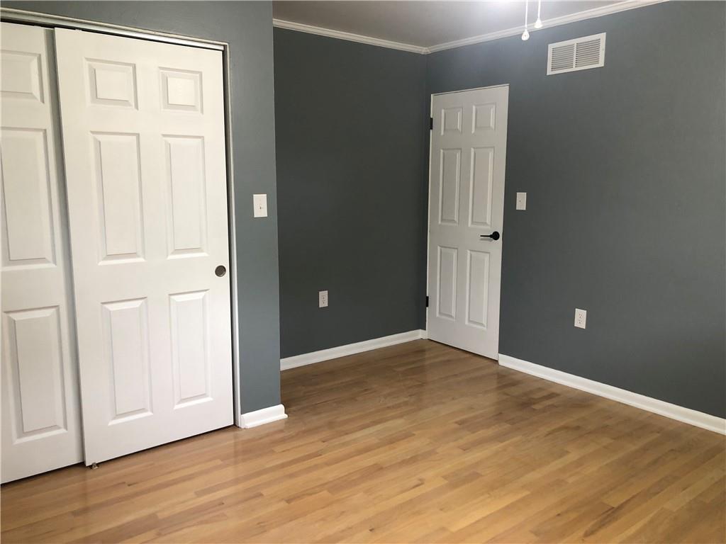 312 Cherokee Drive Butler, PA 16001 - Photo 13 of 40 an empty room with wooden floor and closet area