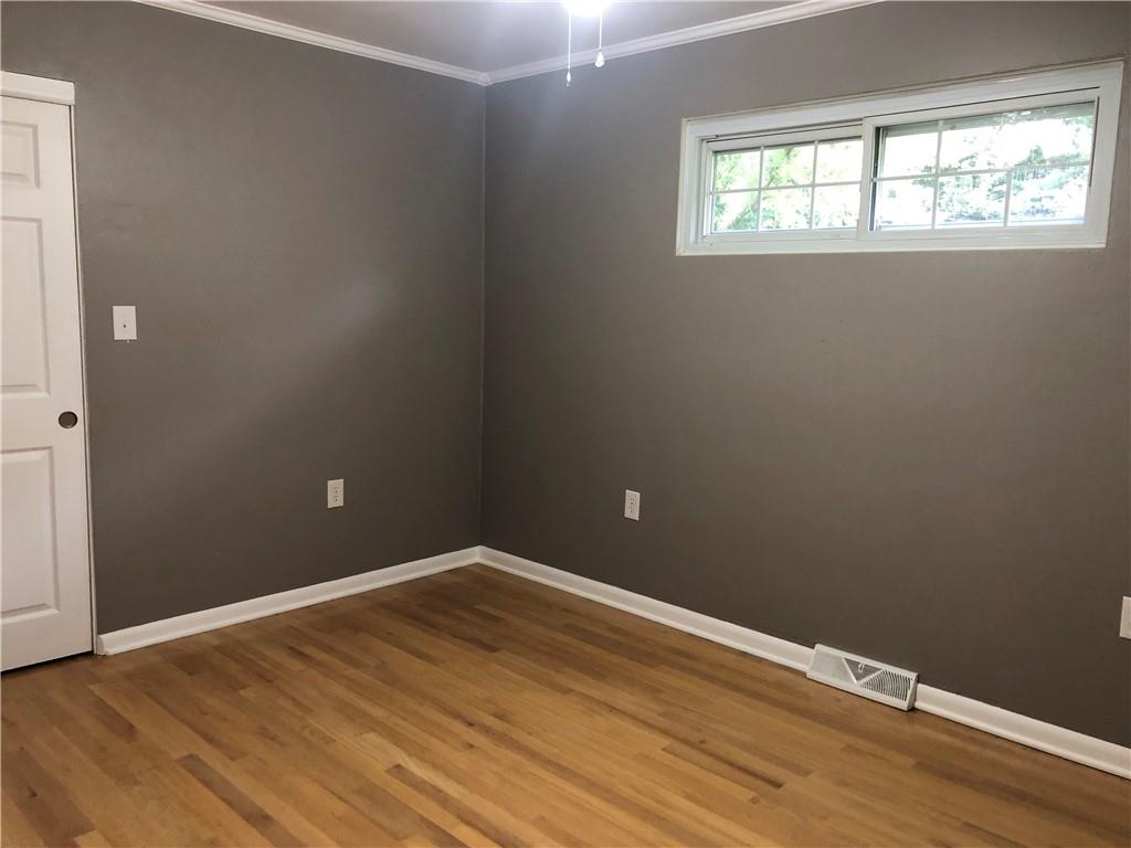 312 Cherokee Drive Butler, PA 16001 - Photo 14 of 40 an empty room with wooden floor and windows