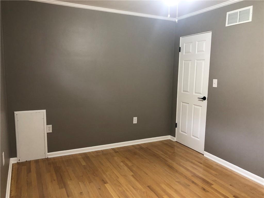 312 Cherokee Drive Butler, PA 16001 - Photo 15 of 40 an empty room with wooden floor and windows